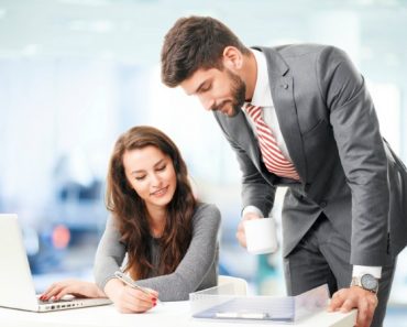 Business people with laptop, sitting at office and consulting.