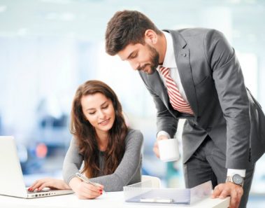 Business people with laptop, sitting at office and consulting.